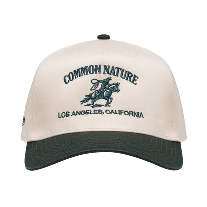 Rider's Hat in natural and black, front view with embroidered rider and Common Nature logo