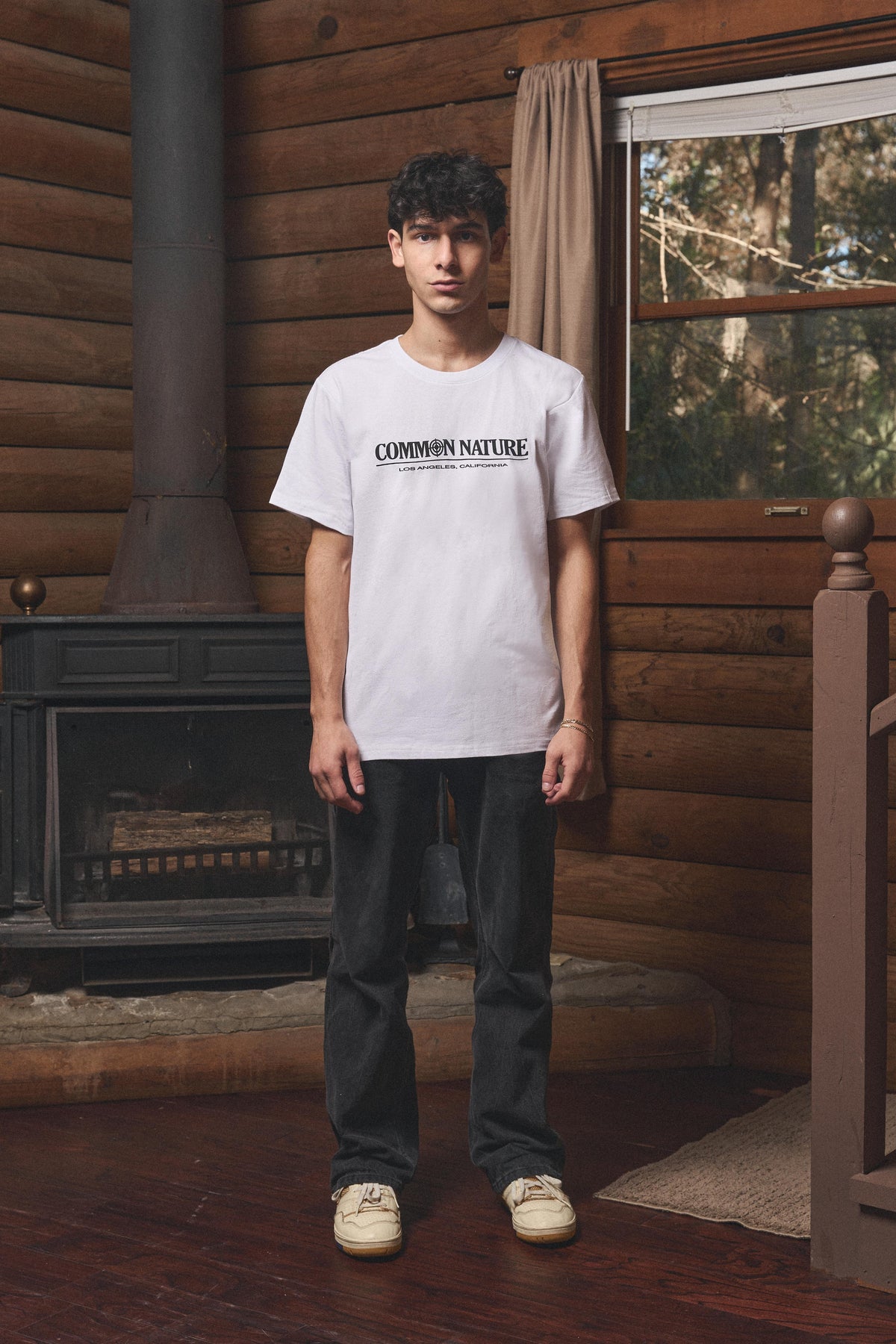 Man wearing the Western Frontier Tee in white, front view
