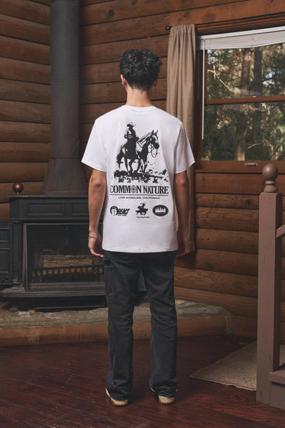 Man wearing the Western Frontier Tee in white, back view