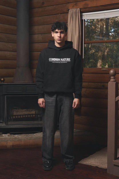 Man wearing the Western Frontier Hoodie in black, front view